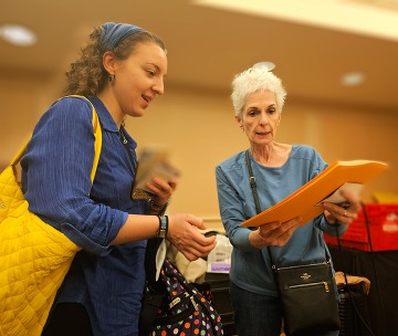 Woman receiving registration materials