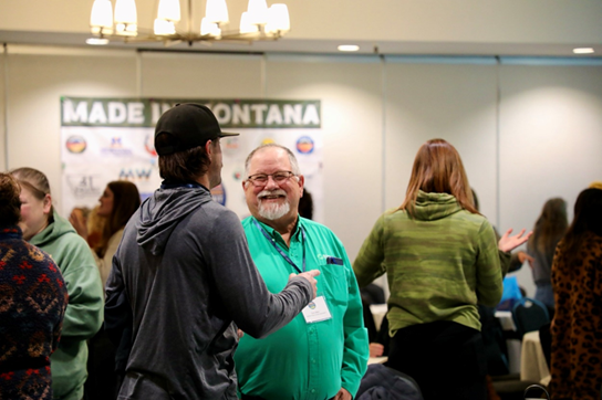Two men in the Summit talk at Montana State University