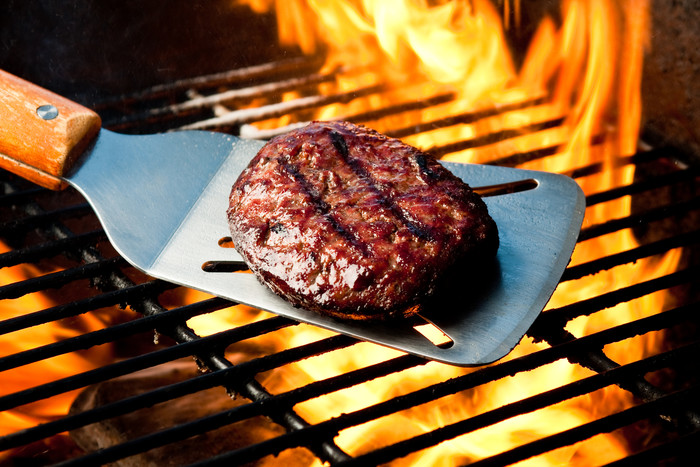 Burger over a grill