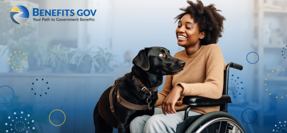 Young woman in a wheelchair pets a black Labrador guide dog 