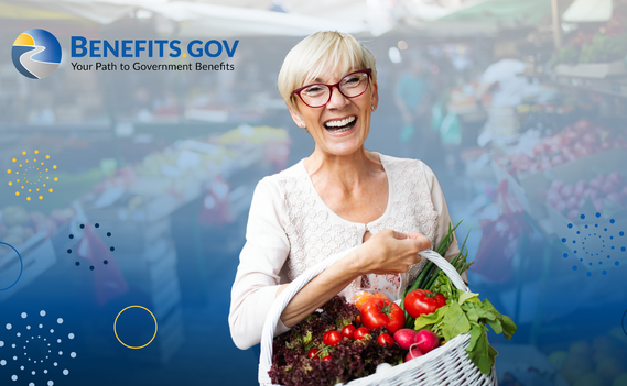 Older adult woman smiles while holding a backet of fresh fruits and vegetables