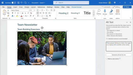 Alt Text pane open for image with Alt text description: Three people talking at a table. One types on a laptop while another writes notes.