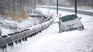 car on the side of a snowy road