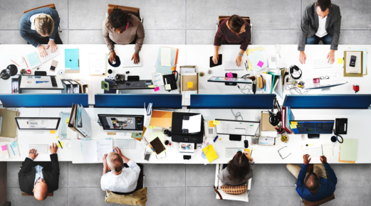 Overhead visual of people sitting at computers.