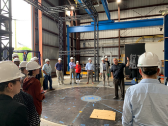 EEI Associate Director Erik Salna, standing on the turntable used to rotate test samples and the netting used to catch flying debris