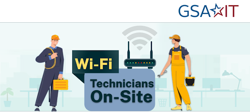 two technicians carrying tools and cables standing next to a wi-fi router