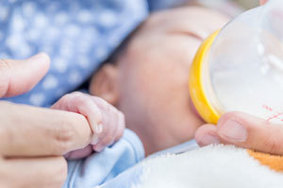 Baby feeding from bottle