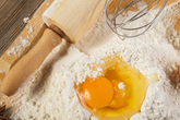 Baking with eggs, flour and rolling pin