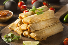 Pile of tamales on a platter