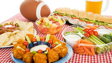 Buffet table with food and a football