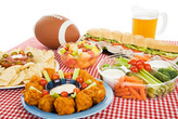 Food platters on a table with a football