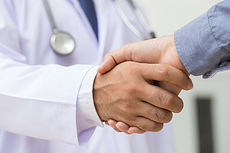 doctor and patient shaking hands