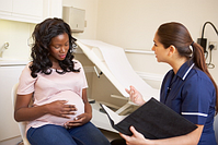 stock photo of a pregnant woman with a doctor