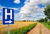 photo of a hospital sign on a rural road