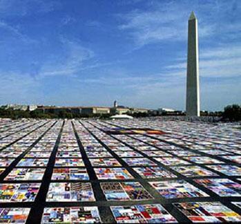 Photo of the HIV/AIDS quilt laid out on the National Mall in the 1980s