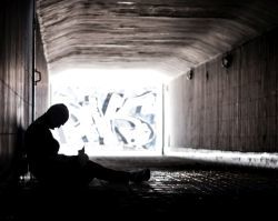 homeless man in an underpass