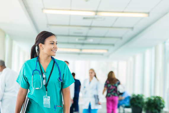 Woman clinician in scrubs