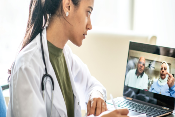 physician using telehealth with older adult minority patients
