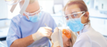 dentist and hygienist working on patient