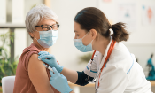 older adult female getting vaccine