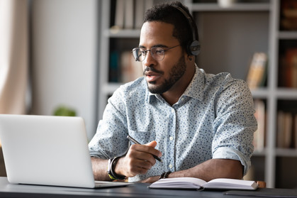 Black male student working on a computer