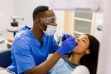 dentist examining patient's teeth