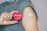 covid-booster-arm-with-bandaid