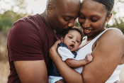 African American couple with newborn baby