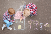 kids playing with chalk outside