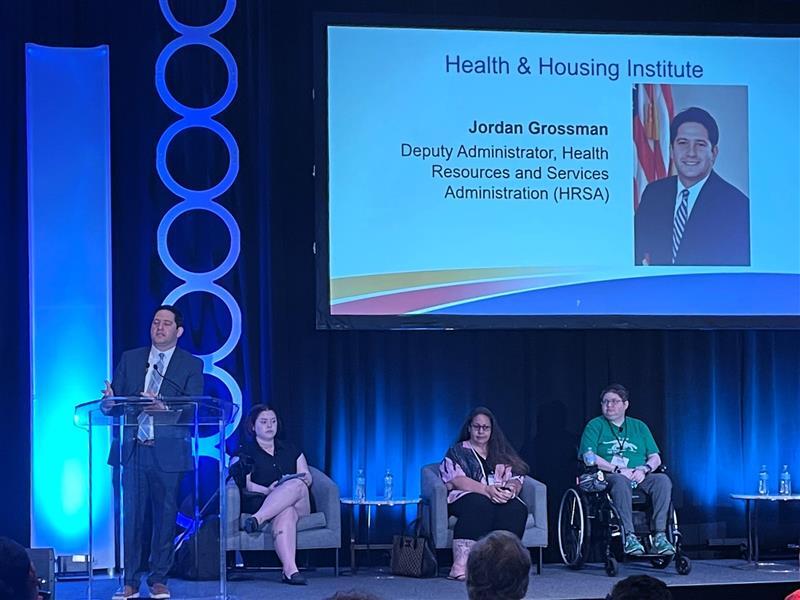 HRSA Deputy Administrator Jordan Grossman speaking at the Advancing Housing, Health, and Social Care Partnerships Conference