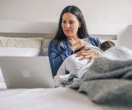 Mother and infant doing a telehealth visit on a computer