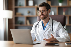 Provider using a computer for telehealth