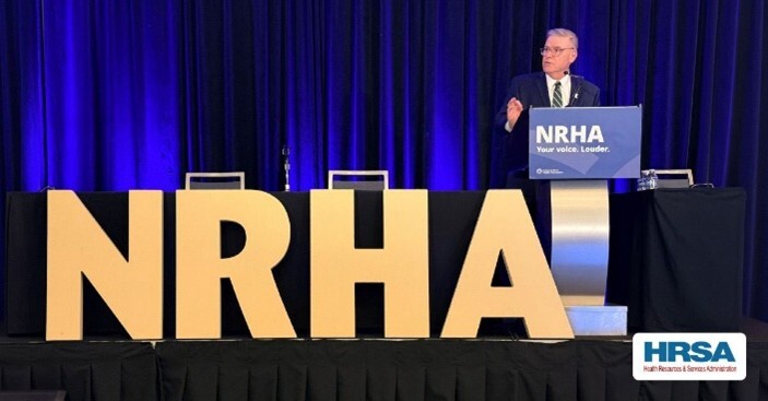 Administrator speaking at event