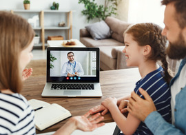Child with parents on a telehealth appointment