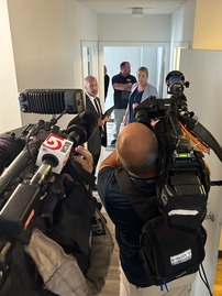 people leading news camera crew