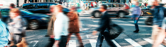 people crossing the street in motion