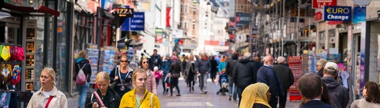 image of people on main shopping street in European city