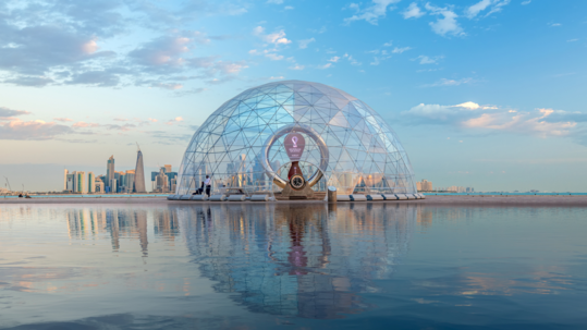 photo of Qatar World Cup stadium on water with city in background