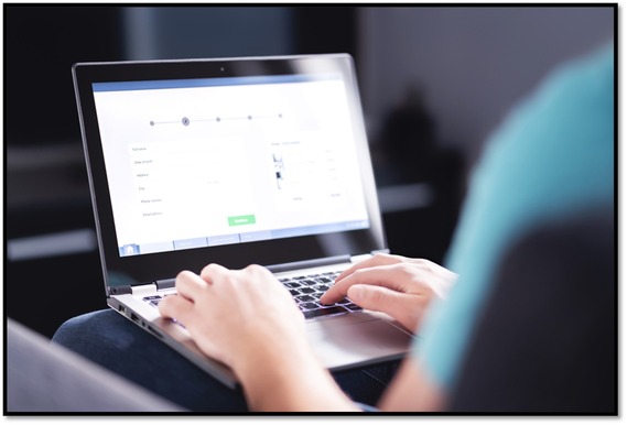 Person accessing a website on his laptop