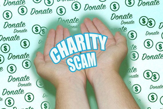 Cupped hands extended on green background with text reading "Charity Scam". Background pattern with the word "donate" and dollar sign coins symbol