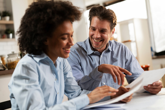 Husband and wife preparing paperwork