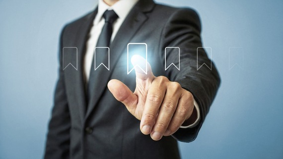 Businessman pressing virtual bookmark icon - managing digital content