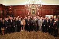 Secretary Raimondo poses for a group photo with participants