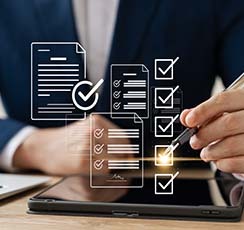 Image of man checking boxes in a document