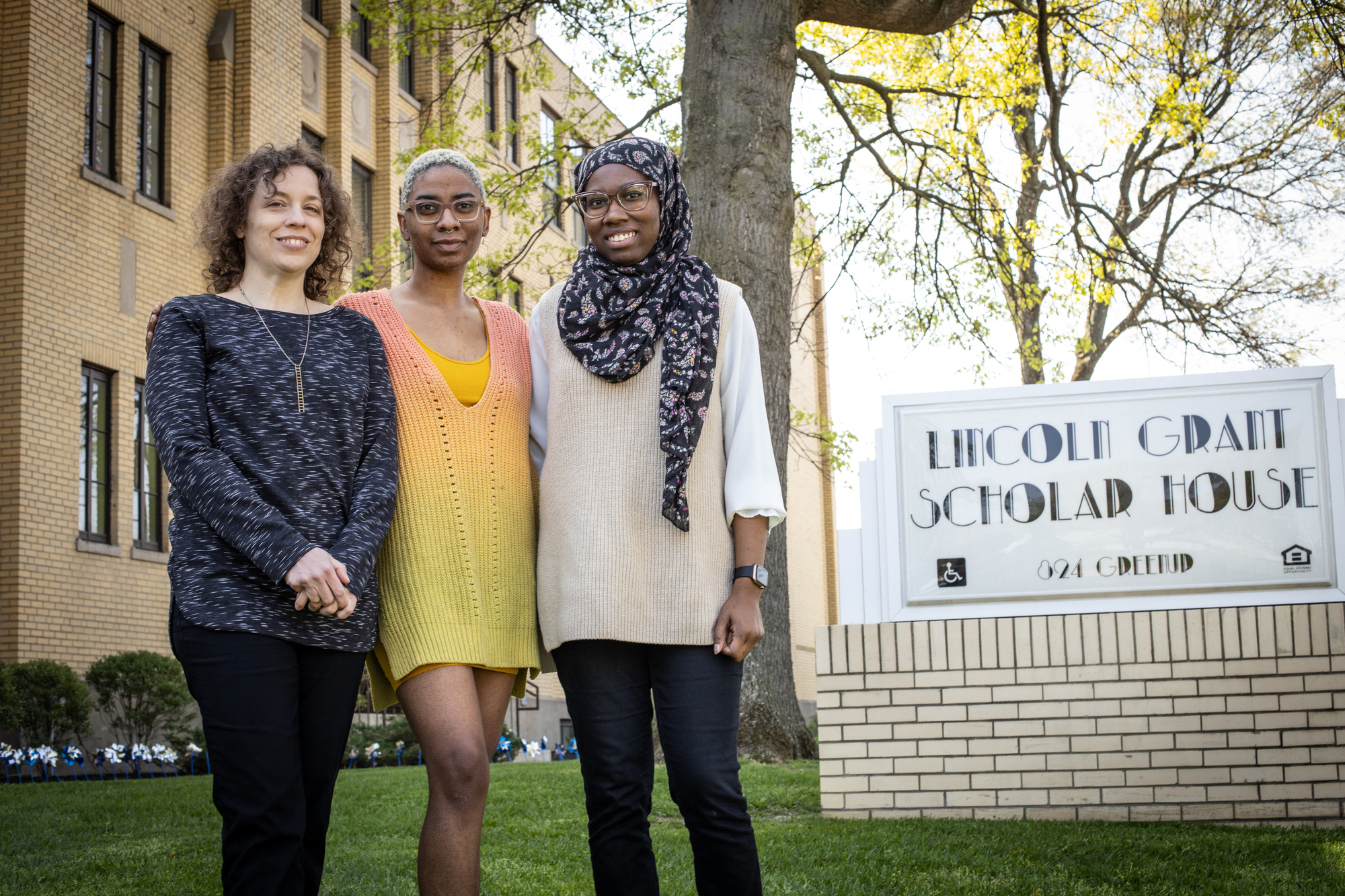 Three recipients of the CCDI grant for libraries, archives, and museums pictured together outdoors. 