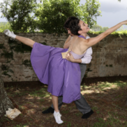 Mélange Dance Theater dancer in a flowing purple skirt