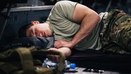 service member sleeping in truck bed