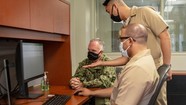 men looking at computer