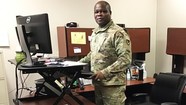 soldier working at standing desk