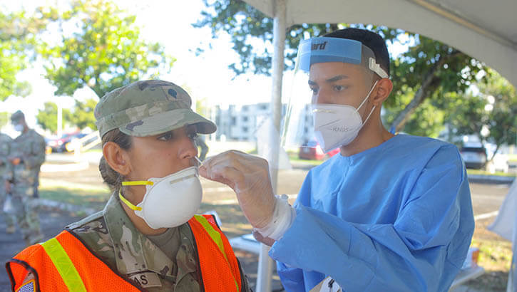 Corporal performing COVID test